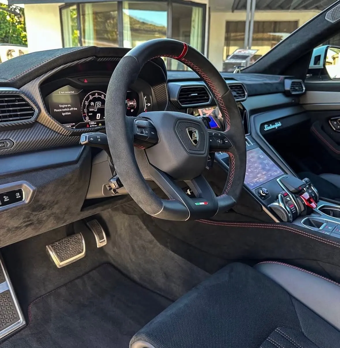 Lamborghini Urus cockpit and Alcantara steering wheel after detailing